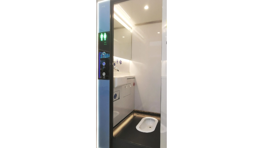 Squat-toilet interior with occupancy control panel inside a modular unit
